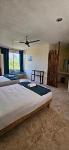 Postel nebo postele na pokoji v ubytování Hotel Villas Coral