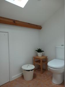 a bathroom with a toilet and a stool at A Casa da Vila in Alcochete +53 photos