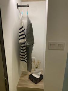 a bathroom with two towels hanging on a rack at Mixx Express Hotel Sunway in Petaling Jaya