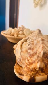 two plates of food sitting on a table at Pousada 100 passos in Tamandaré +18 photos