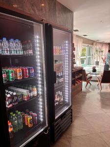an open refrigerator filled with lots of drinks at Flat Barra Residence-3 pessoas-Fa1204-4 in Rio de Janeiro