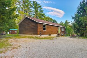 a cabin in the woods with a gravel driveway at 9 Mi to Hickory Ski Center Wooded Warrensburg Gem in Bolton