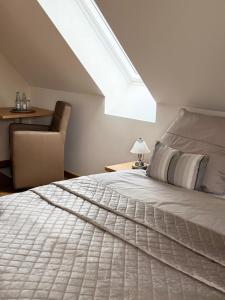 Postel nebo postele na pokoji v ubytování Dat Lütte Hus