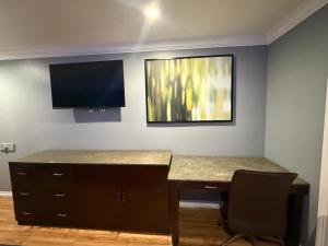 TV a/nebo společenská místnost v ubytování BELL RESORT MOTEL