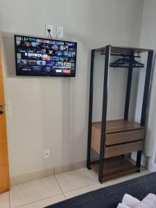 Ένα ή περισσότερα κρεβάτια σε δωμάτιο στο Cantinho de aconchego 02 - com ar condicionado