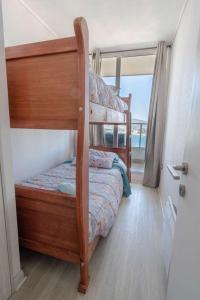 Postel nebo postele na pokoji v ubytování Vista al mar y relax total en el corazón de Concón + 7 fotografií