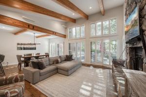 a living room with a couch and a fireplace at Ridge Court # 13 by Tahoe Getaways - 3BR Palisades at Alpine Condo w Ski Shuttle & Tennis! in Alpine Meadows