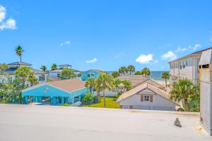 a street view of a residential neighborhood with houses at Carousel Suites -Redington Shores in Redington Shores