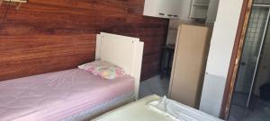 Ένα ή περισσότερα κρεβάτια σε δωμάτιο στο Pousada Malibu Playa