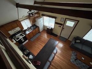 an overhead view of a kitchen and living room at Home in Arrowhead Lake Pocono PA - Lake Access, Hot Tub, Fire Pit, and Amenities Included in Arrowhead Lake