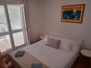 Postel nebo postele na pokoji v ubytování Holiday Home Lucica 5679