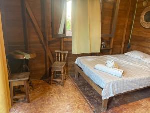 Ένα ή περισσότερα κρεβάτια σε δωμάτιο στο Cabañas Ciricote