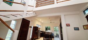 a kitchen and dining room with a loft at MINI PINI BIRD WATCHING AND CENOTE Loft in Cozumel