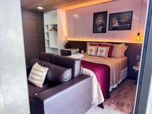 Postel nebo postele na pokoji v ubytování NEW TIME- Conforto e Excelência SC Hospedagens Premium + 50 fotografií