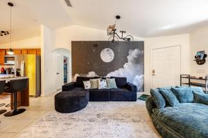 a living room with a couch and a table at Magical World in Davenport