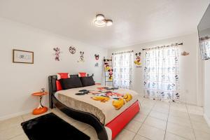 a bedroom with a large bed with toys on it at Magical World in Davenport +85 photos