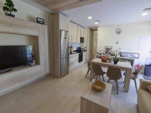 a living room with a kitchen and a dining room at Only adults rural house in Burgos in Barbadillo del Mercado
