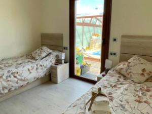 a bedroom with two beds and a large mirror at Only adults rural house in Burgos in Barbadillo del Mercado +11 photos