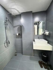 a bathroom with a sink and a shower at Lavie Hotel in Hanoi +31 photos