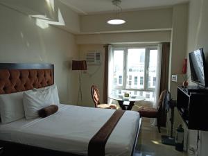 TV a/nebo společenská místnost v ubytování Studio unit at The Beacon Makati near Greenbelt