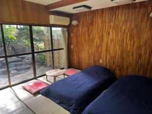 Postel nebo postele na pokoji v ubytování Retreat Narita