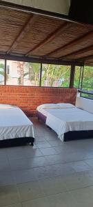 Ένα ή περισσότερα κρεβάτια σε δωμάτιο στο Villa Campestre Eagle