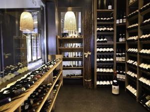 a wine cellar with lots of bottles of wine at ibis Beaune La Ferme Aux Vins in Beaune