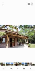 une maison avec une table de pique-nique devant elle dans l'établissement Cabañas Bendita Tierra- Crespin, à Los Molles