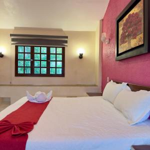 Postel nebo postele na pokoji v ubytování Hotel Barranquilla