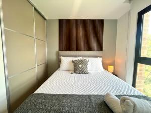a bedroom with a bed with a pillow on it at Luxury stay in zone 14 in Estación Pamplona +39 photos