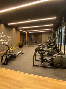 a gym with rows of exercise bikes in a room at Luxury stay in zone 14 in Estación Pamplona