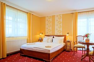 Postel nebo postele na pokoji v ubytování Hotel Godewind