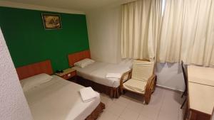 Postel nebo postele na pokoji v ubytování Hotel City View