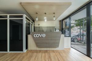 a lobby with a cvo sign on the front of a building at Cove Ananya in Surabaya