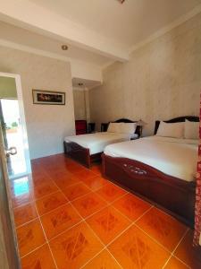 Postel nebo postele na pokoji v ubytování Emiramona Garden Hotel