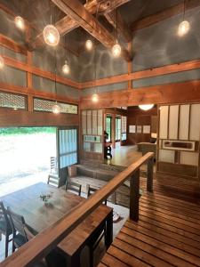 a dining room with a table and chairs at Anju KAGUYA 香宮宿 in Katori