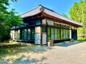 a building with a pavilion in a park at Anju KAGUYA 香宮宿 in Katori