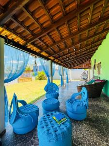 a group of blue inflatables are lined up on a patio at Pousada da Ana in Estivado