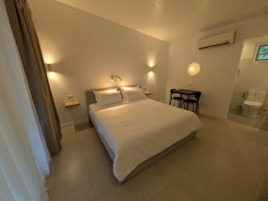 Ένα ή περισσότερα κρεβάτια σε δωμάτιο στο Banana Beach Club