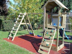 a playground with a ladder and a play structure at Mobil home avec terrasse à Gurmençon - API-1-52-612 in Gurmençon