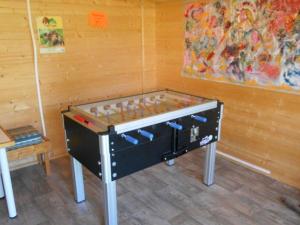 a foosball table in the corner of a room at Mobil home avec terrasse à Gurmençon - API-1-52-612 in Gurmençon