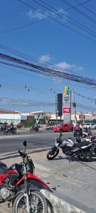 a group of motorcycles parked in a parking lot at Conforto e Lazer no Coração da Ilha de São Luís in São-José-do-Ribamar
