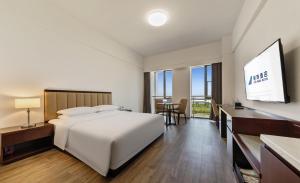 Postel nebo postele na pokoji v ubytování 北京明珠酒店Beijing CSN Pearl Hotel