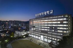 a large building with a sign on top of it at 연 스테이 in Seoul