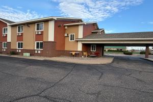 a building on the side of a street at Coratel Inn and Suites by Jasper Stillwater in Stillwater