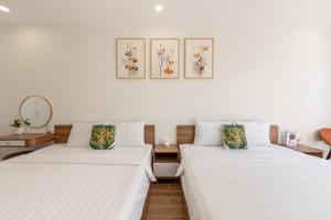 Ένα ή περισσότερα κρεβάτια σε δωμάτιο στο RAINBOW Motel 3