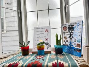 Ένα ή περισσότερα κρεβάτια σε δωμάτιο στο 江の島ハウス