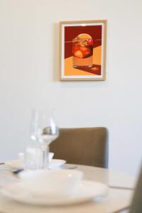 a table with a picture on the wall and a plate on it at Southbank exceptional View with huge balcony High Lvl Suite style APT in Brisbane