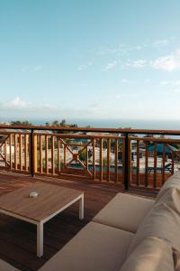 a balcony with a view of the ocean at Les Ti Kaz d'Auguste in Les Avirons