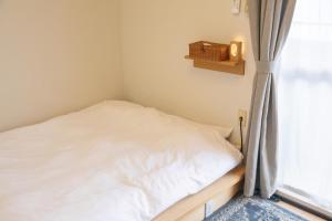 Postel nebo postele na pokoji v ubytování Guesthouse Life Field + 23 fotografií